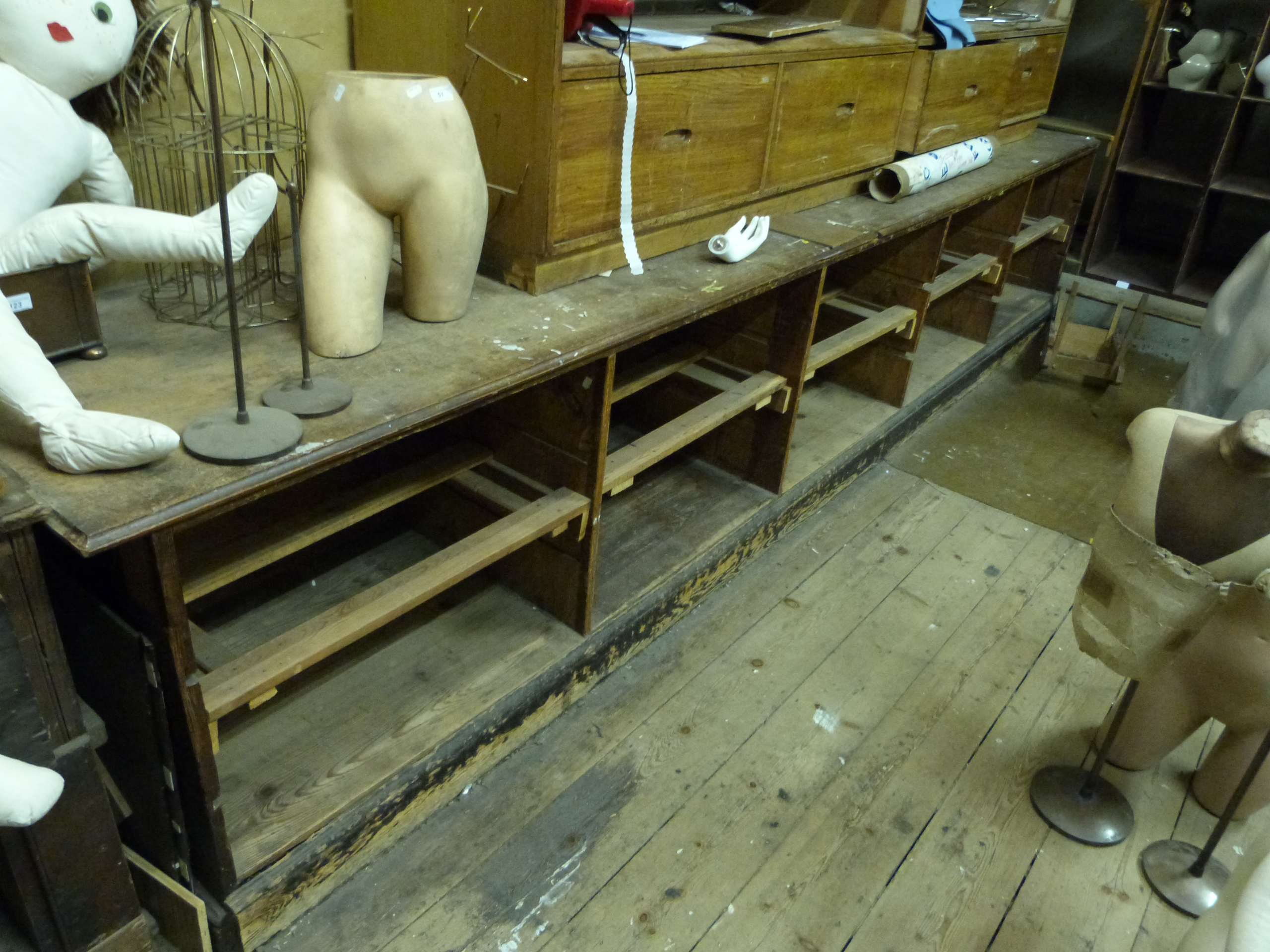 A particularly long serving counter or workbench, having mahogany top, length 420cm depth 73cm