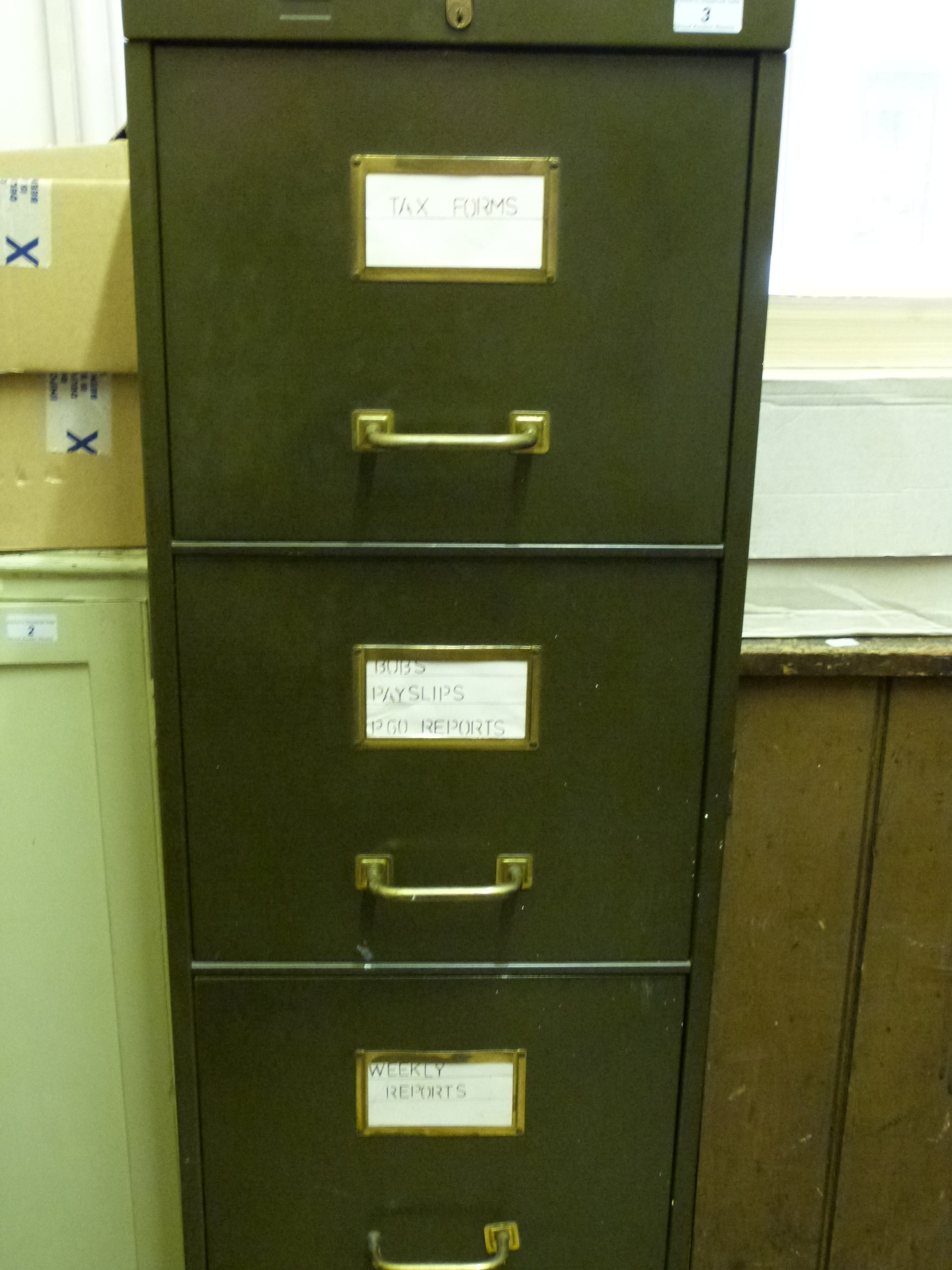 Metal four drawer filing cabinet with brass handles width 38cm depth 66cm height 132cm