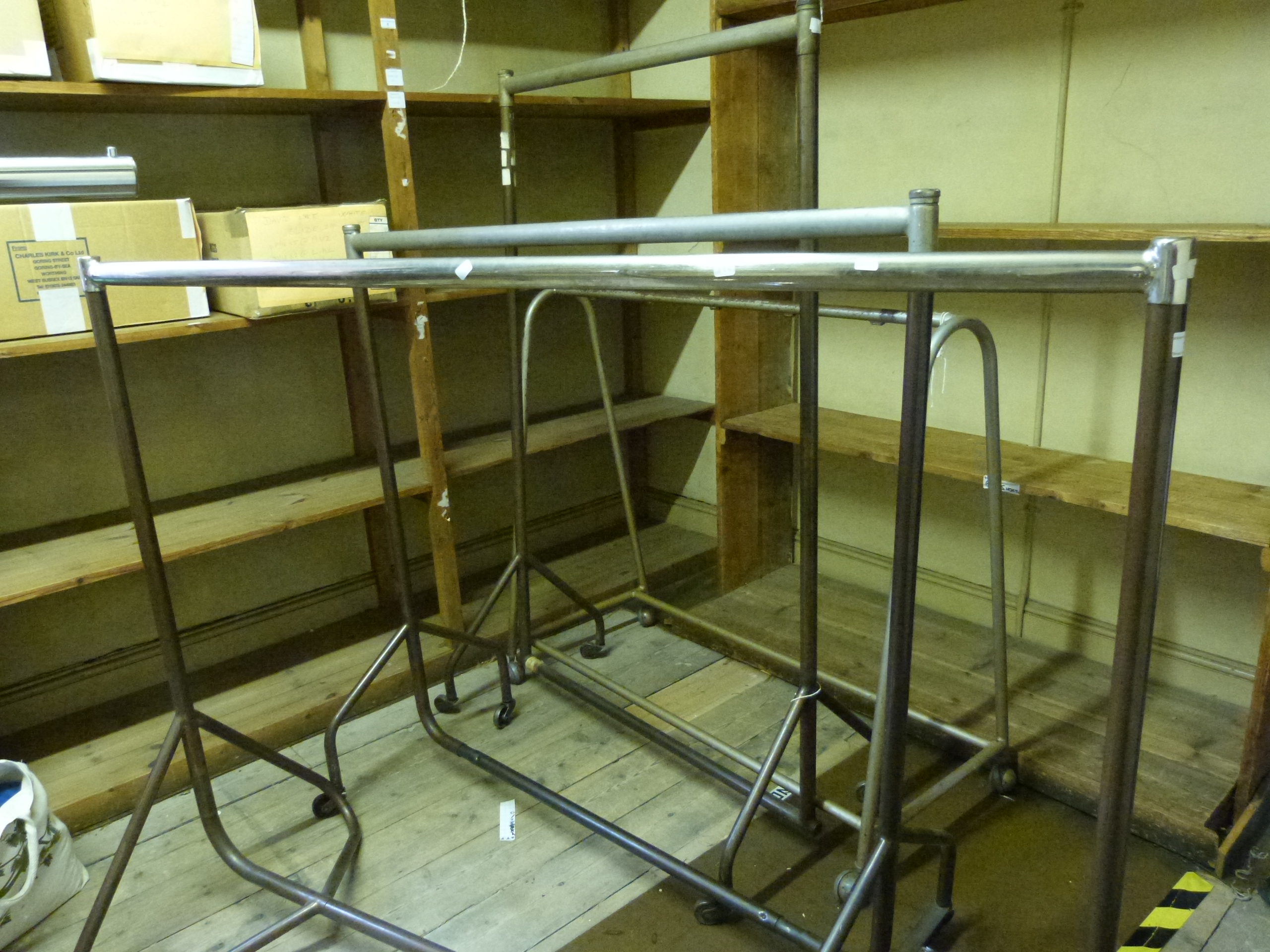 Three various shop fitting type clothes hanging rails lengths approximately 120 to 150cm