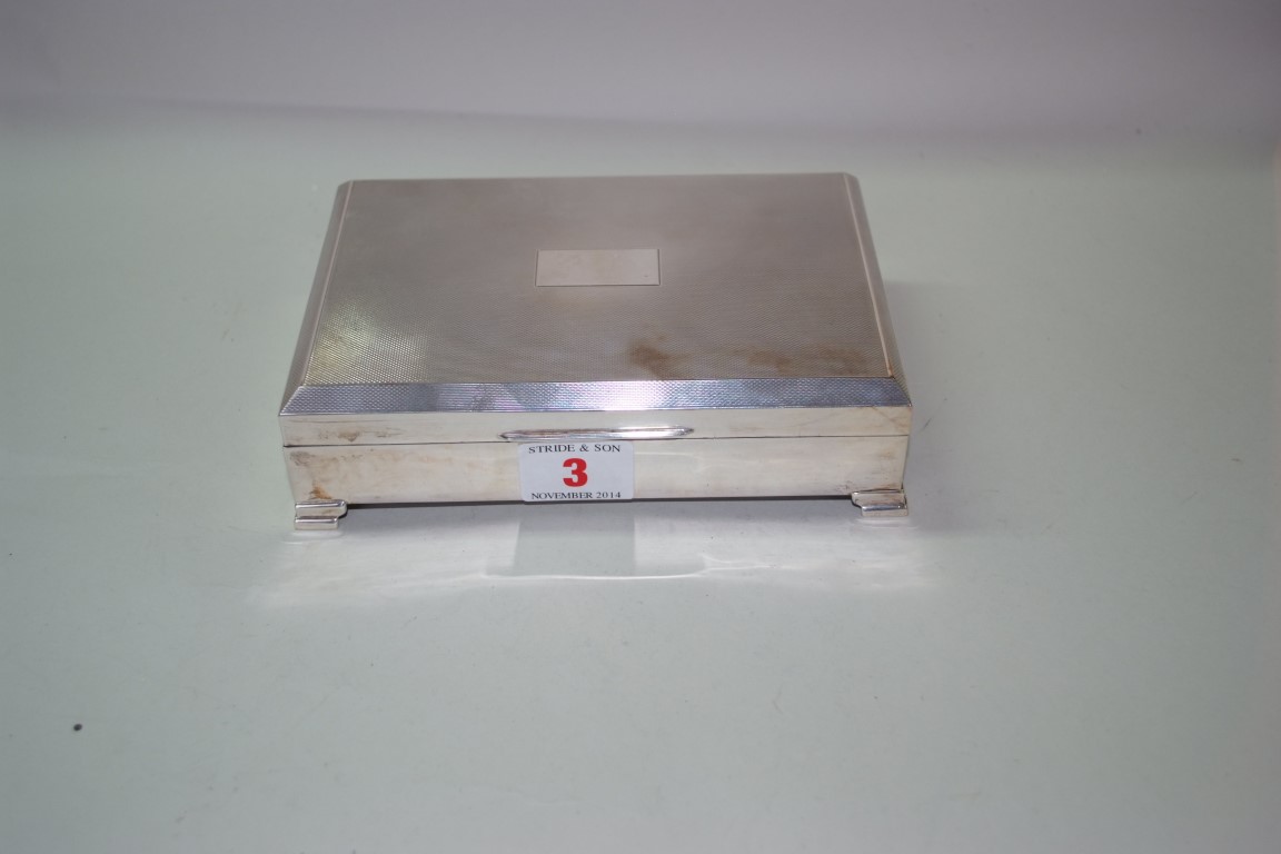 A silver cigarette box, by Henry Clifford Davis, Birmingham 1963, 17cm wide.