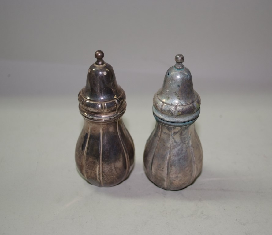 A pair of sterling silver salt and pepper pots, by Pr S, 118g, 10cm.   Condition Report:  One