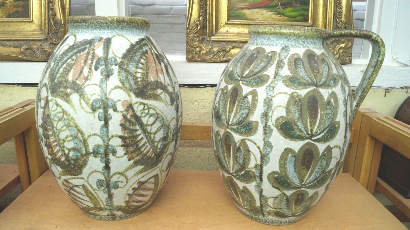 A Denby pottery jug; and a similar vase, 30cm high.    Condition Report:  Both pieces look to be