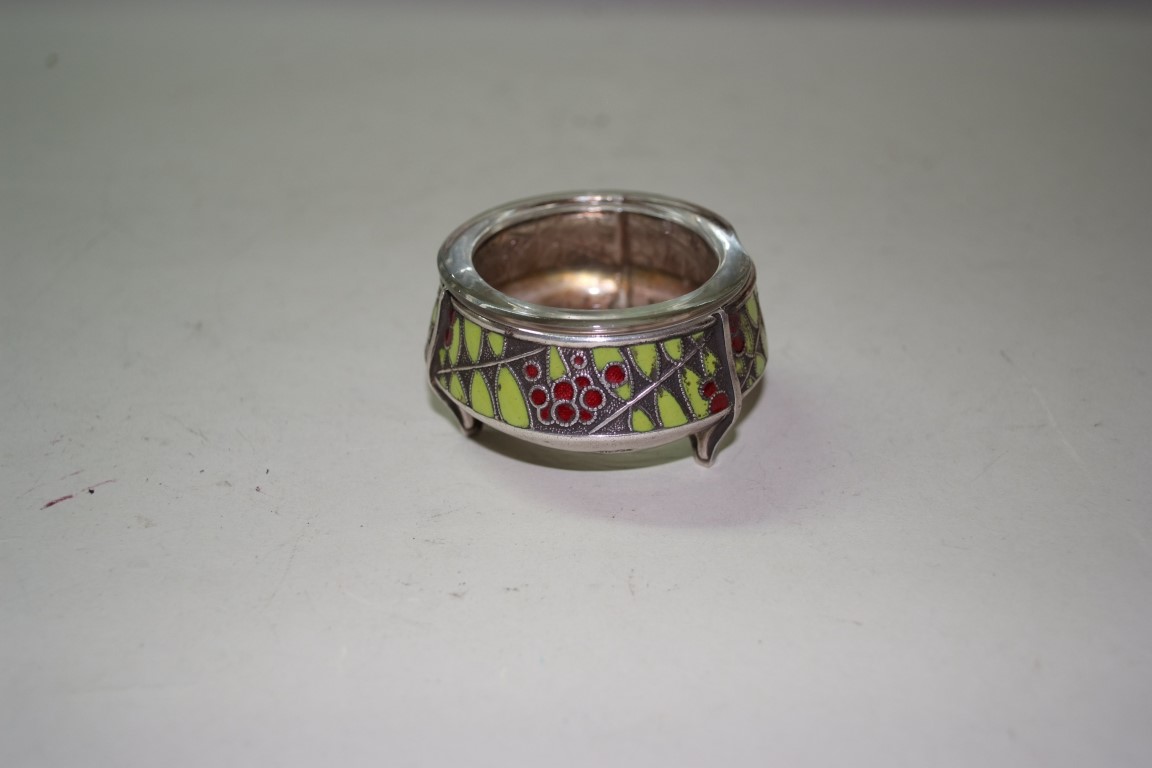 An enamel decorated salt, stamped 75k, possibly Russian, having glass liner.