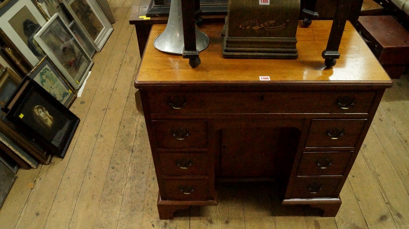 An old mahogany kneehole chest, 80cm wide.    Condition Report:  Overall condition is good,