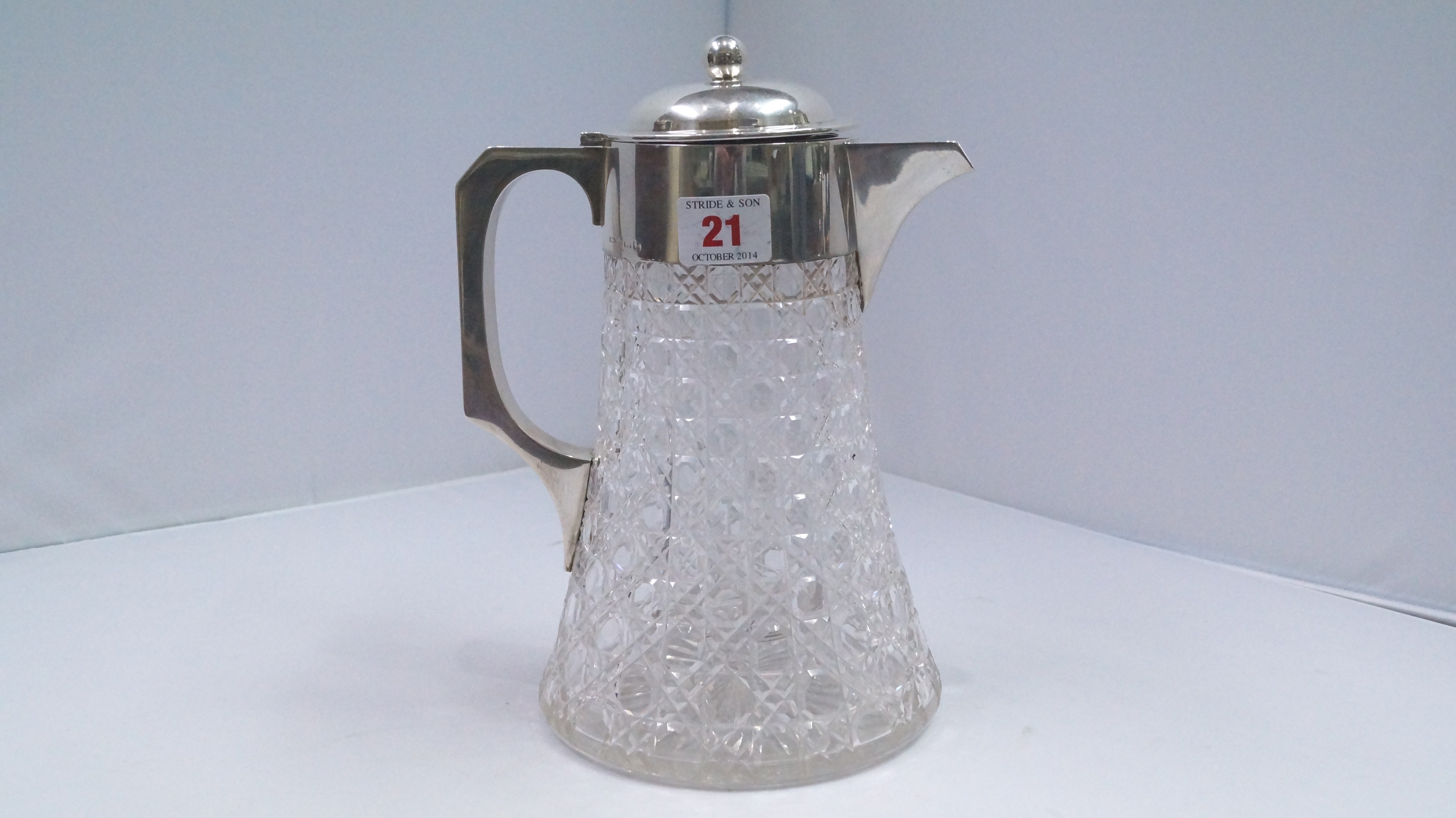 A cut glass and silver mounted lemonade jug, by J.? & S, Birmingham, 1923, 25cm.   Condition Report: