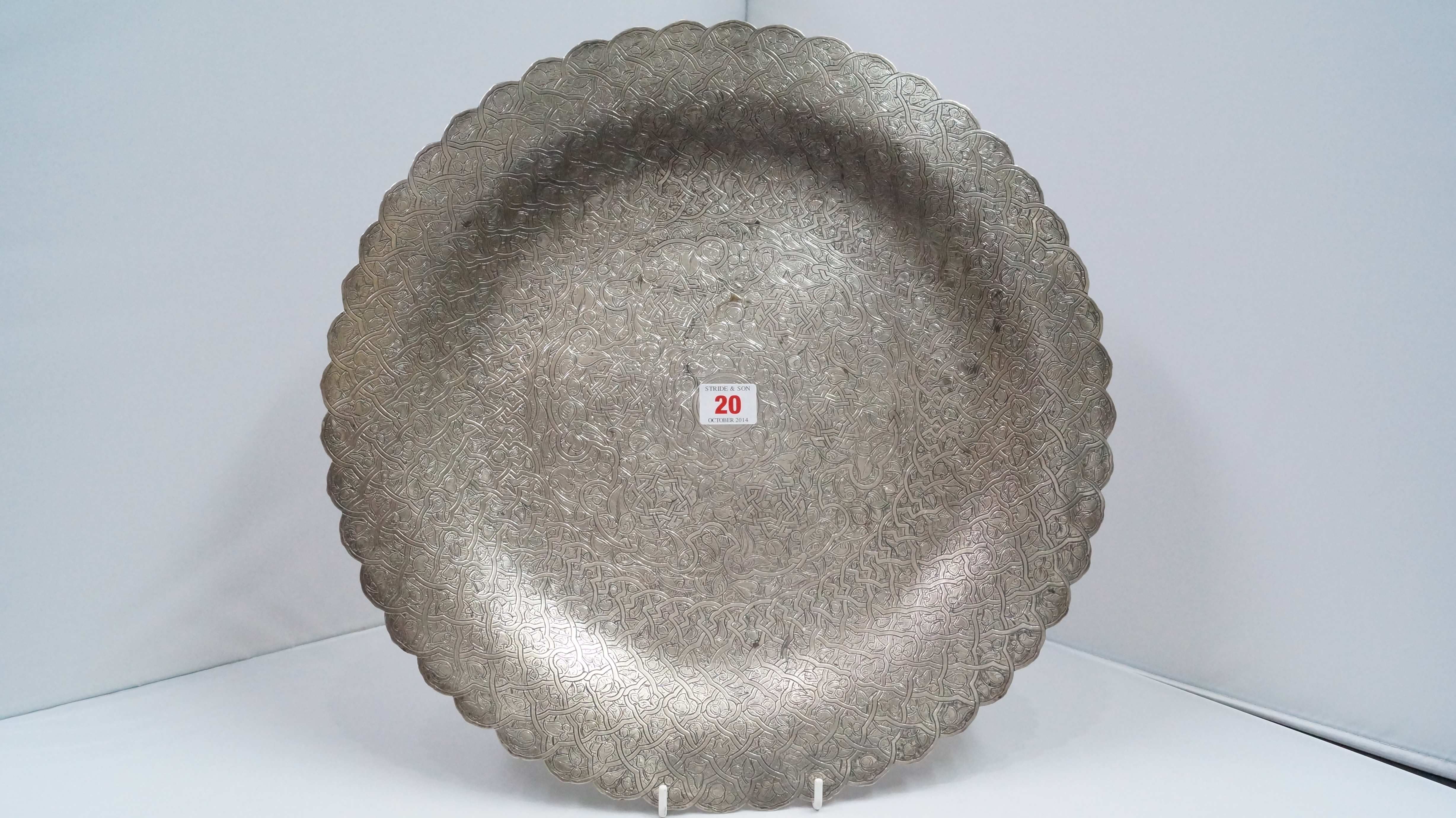 A Persian white metal silver dish, makers marks to reverse, 42cm.