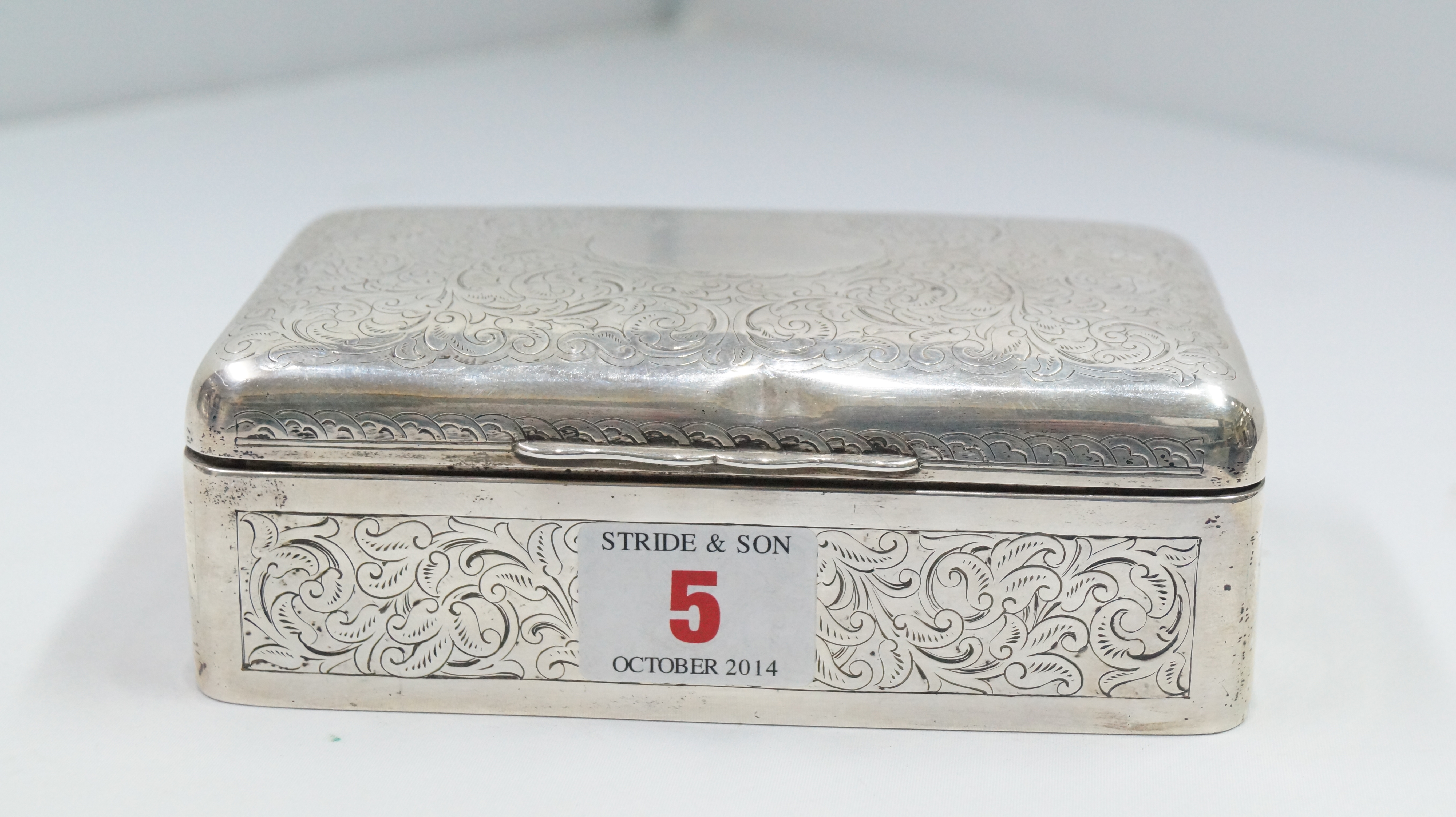 A silver cigarette box, by The Army and Navy Cooperative Society Ltd, London 1996, having floral