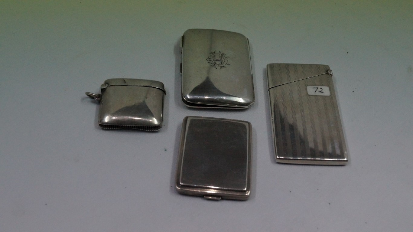 A silver card case, by Deakin & Francis, Birmingham 1911, 9cm,; together with a silver match book