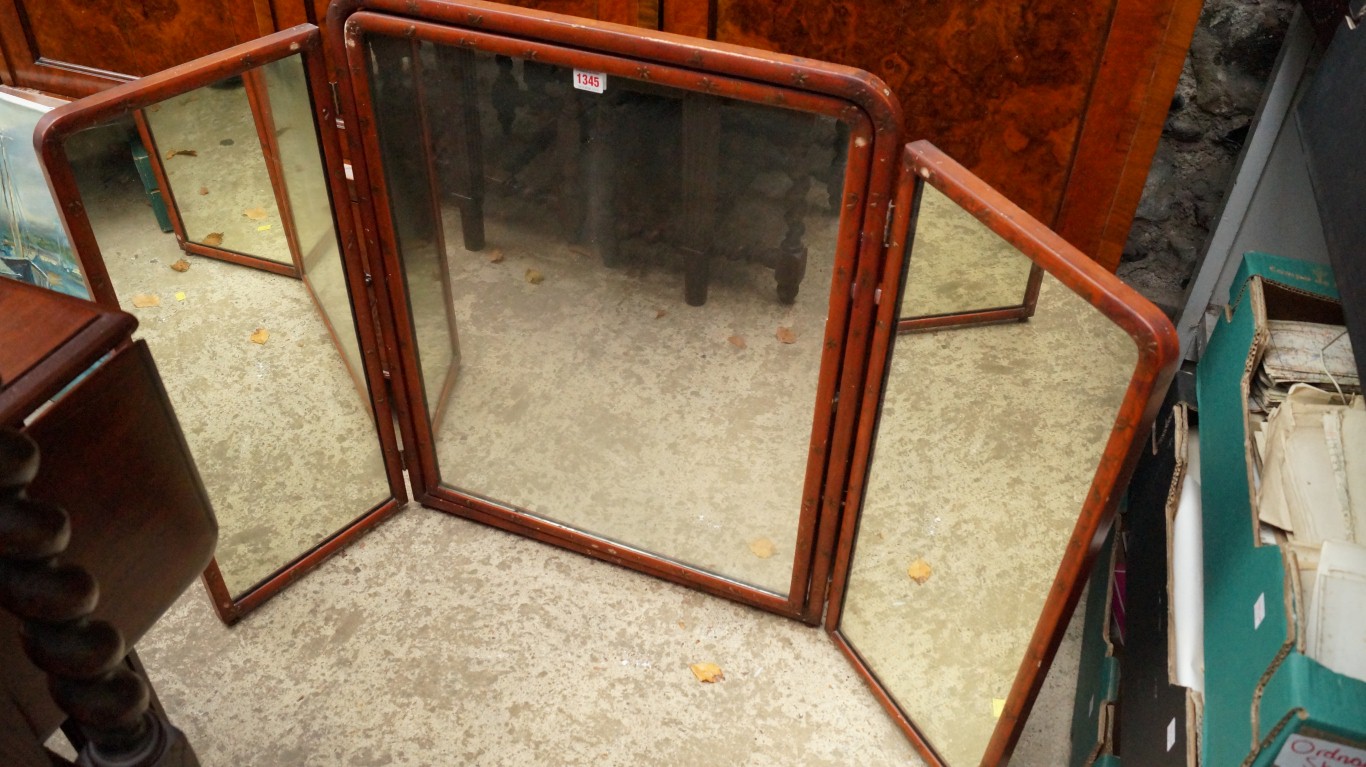 A 1930s red lacquered and gilt chinoiserie triptych mirror, 78cm high.