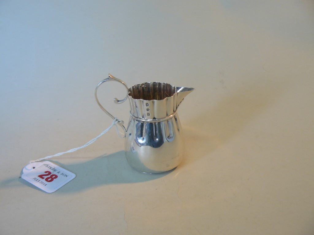 A Victorian silver jug, by John Millwall Banks, Birmingham 1892, in the form of a drawstring bag,
