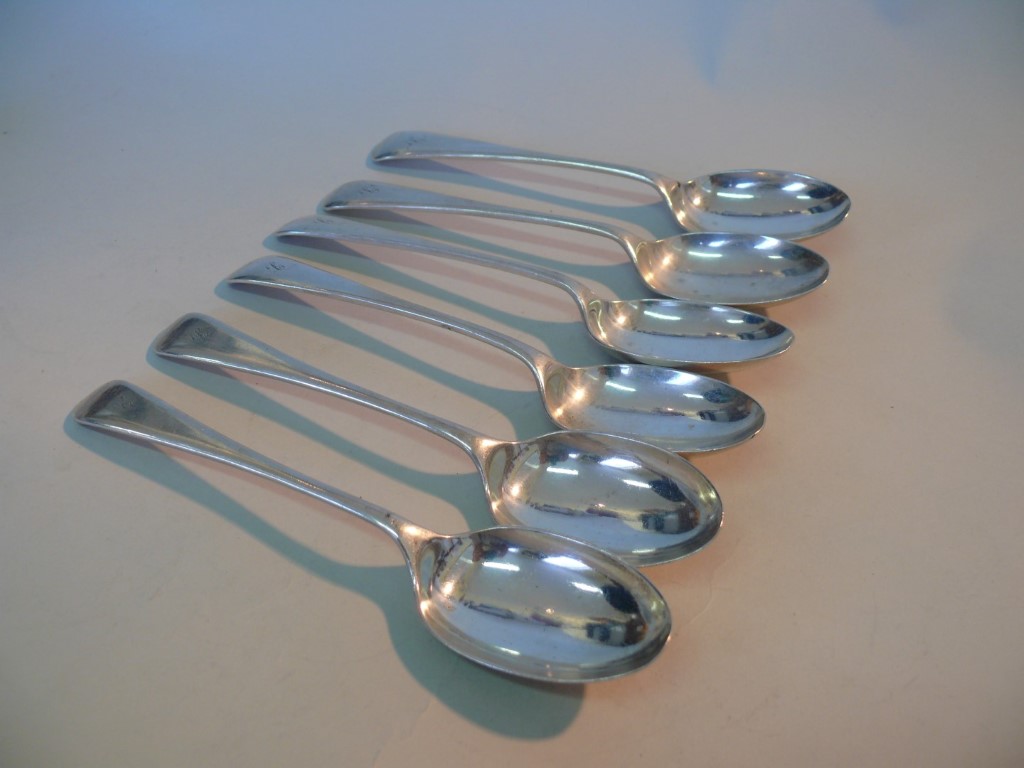 A set of six silver Old English pattern dessert spoons, by Walker & Hall, Sheffield 1919, 322g.