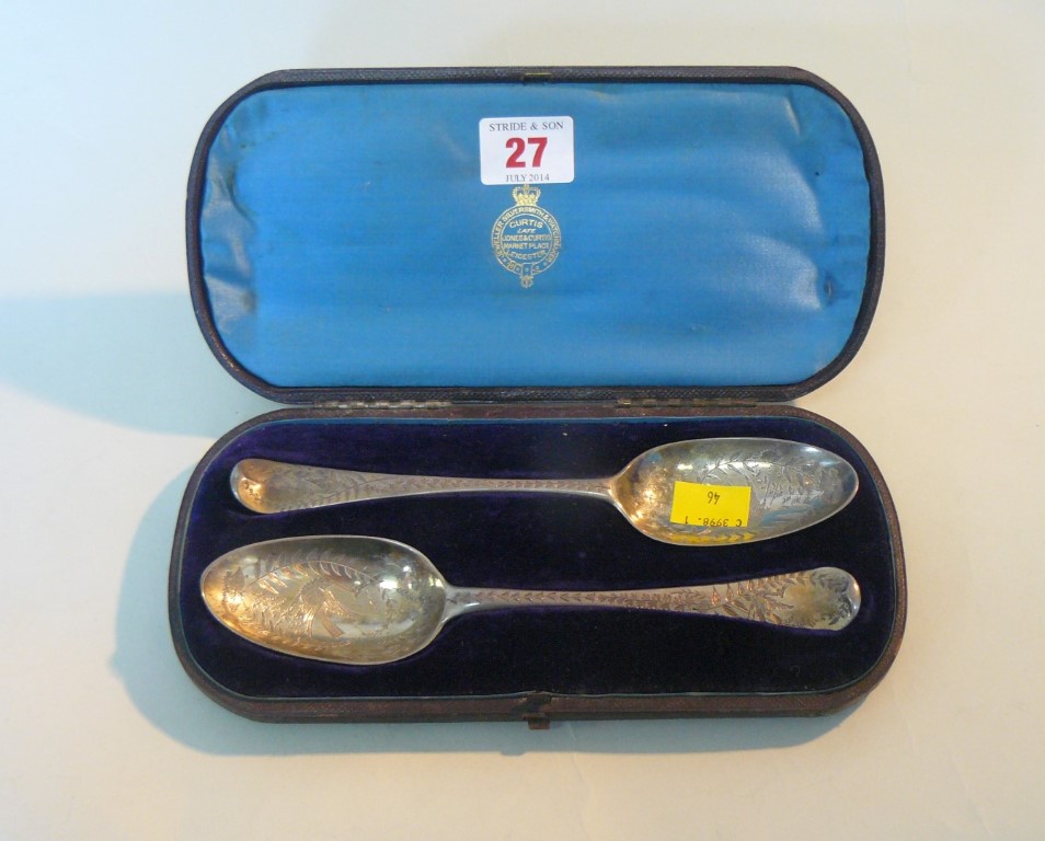 A cased pair of Georgian silver tablespoons, having later engraved decoration, 104g.