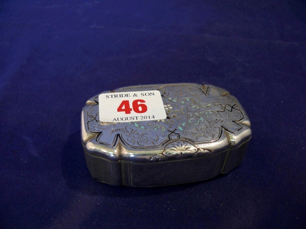 A French white metal snuff box, having coloured enamel inset lid and engine turned decoration to