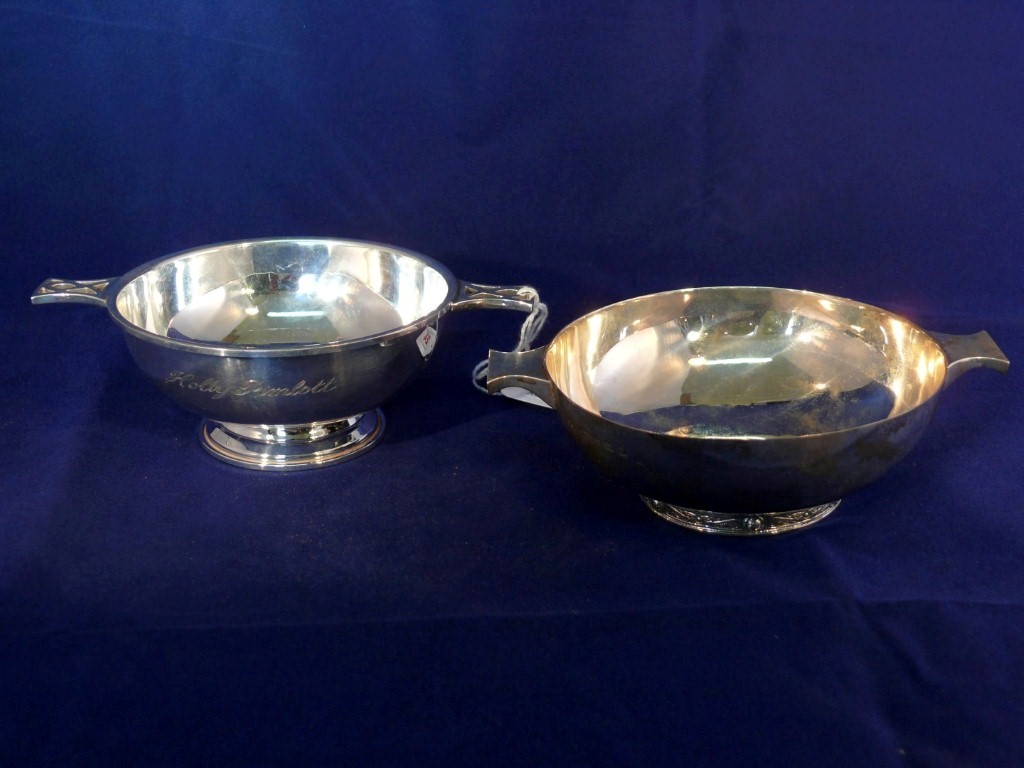 A silver quaich, by Mappin & Webb, Birmingham 2004, 11cm wide, 133g; together with a similar quaich,