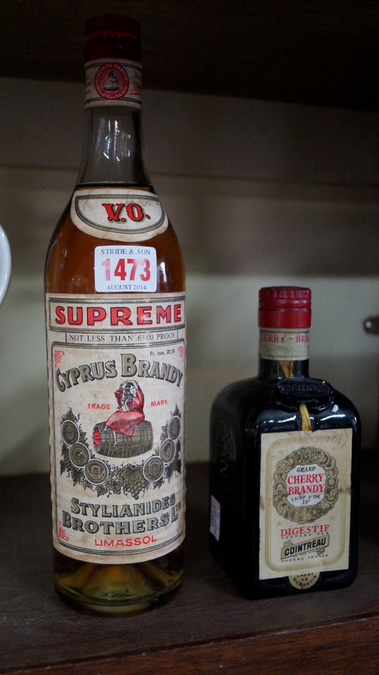 A bottle of Cyprus Brandy, 1970s bottling by Stylianides Brothers; together with a half bottle of