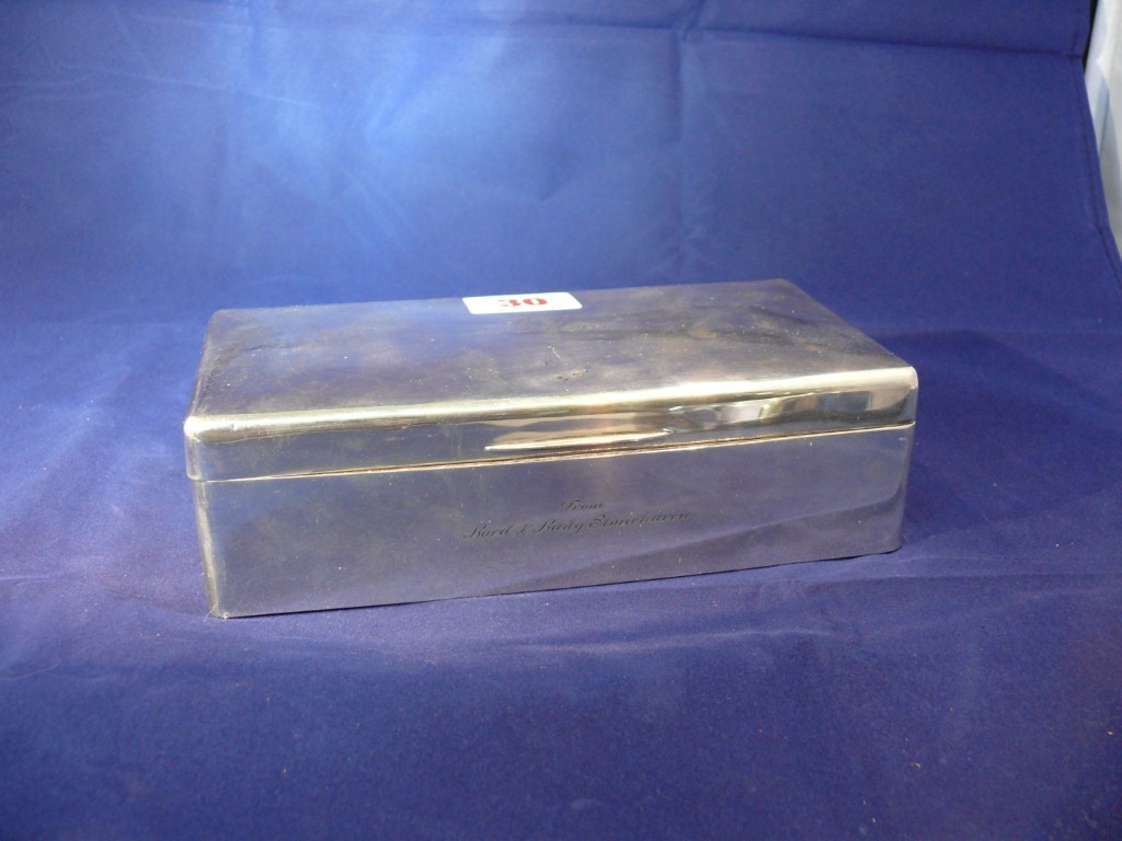 A silver cigarette box, by D & J Welby, London 1933, 18cm.