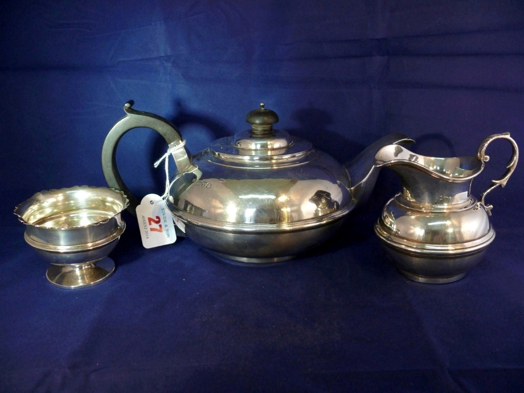 A silver composite three piece teaset, by George Nathan & Ridley Hayes, Chester different dates,