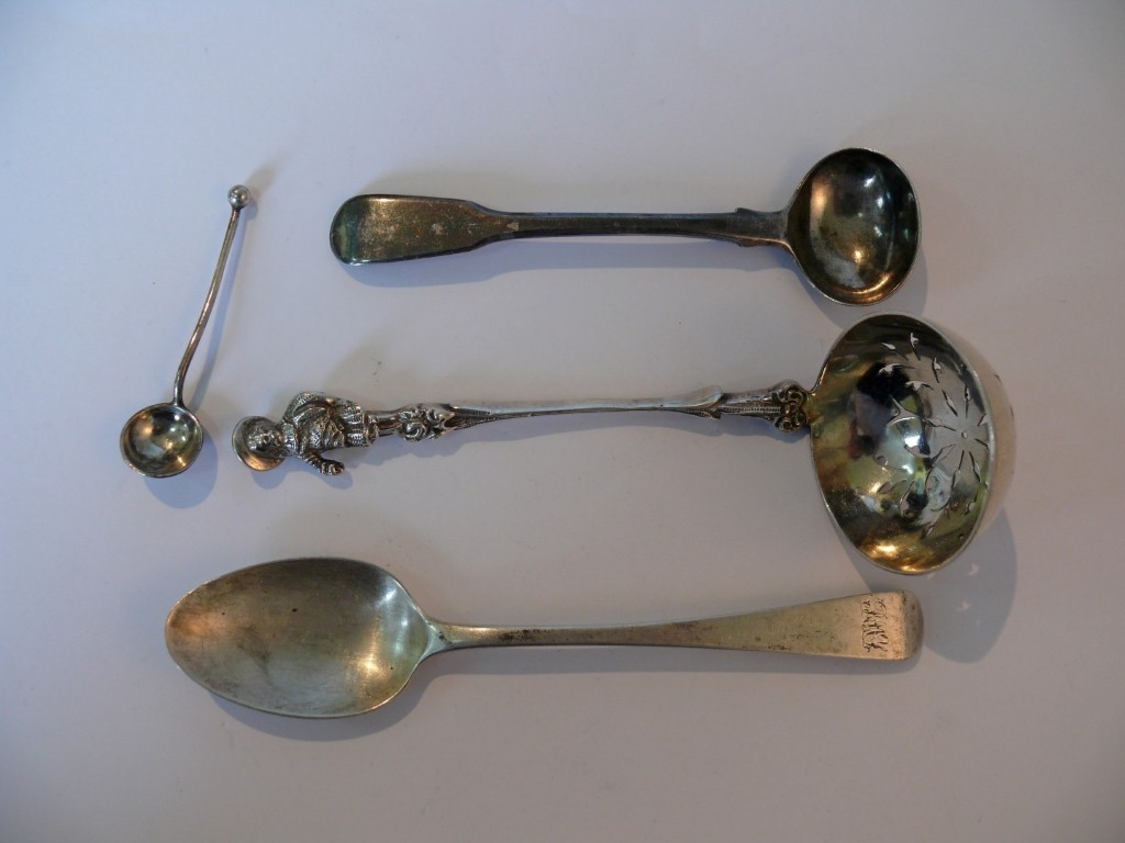 A Victorian silver sugar sifter spoon, by Charles Stuart Harris, London 1886, having figural