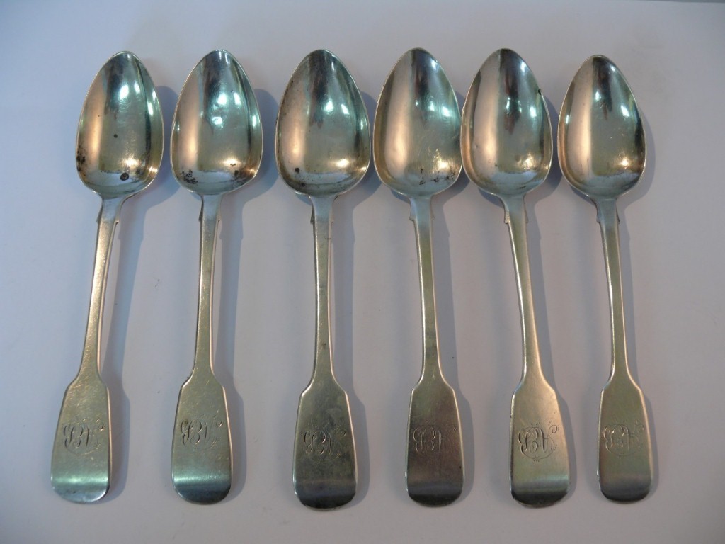 A set of six Irish George III silver fiddle pattern rat tail tea spoons, by I.N, retailed by James R