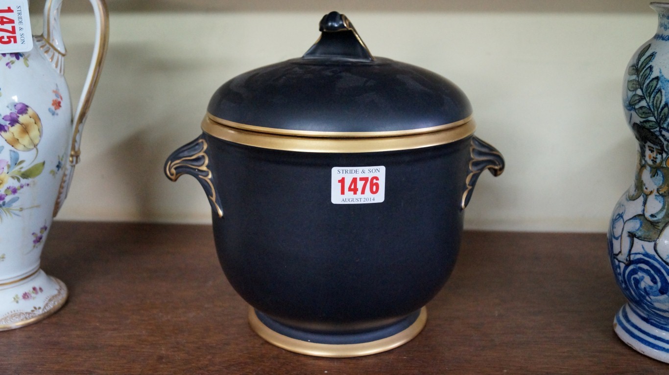 A Coalport black and gilt twin handled ice pail and cover, with internal tray, 22cm high.