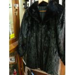 A black mink three-quarter fur coat; tog