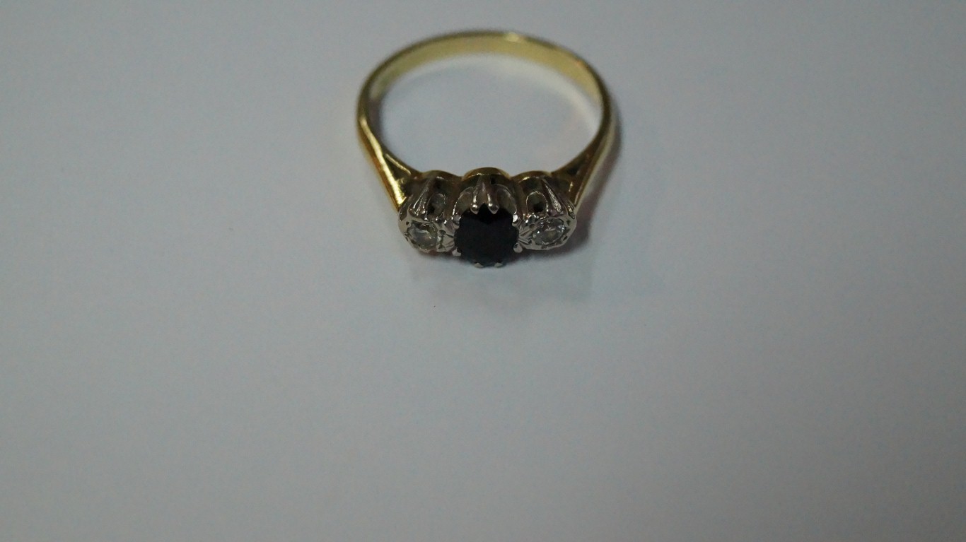A gold diamond and sapphire three stone ring. - Image 3 of 3