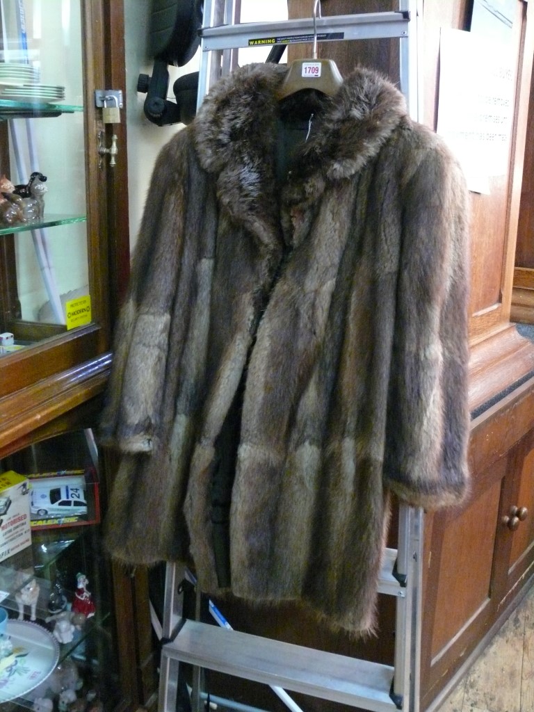 A brown mink three-quarter length fur co