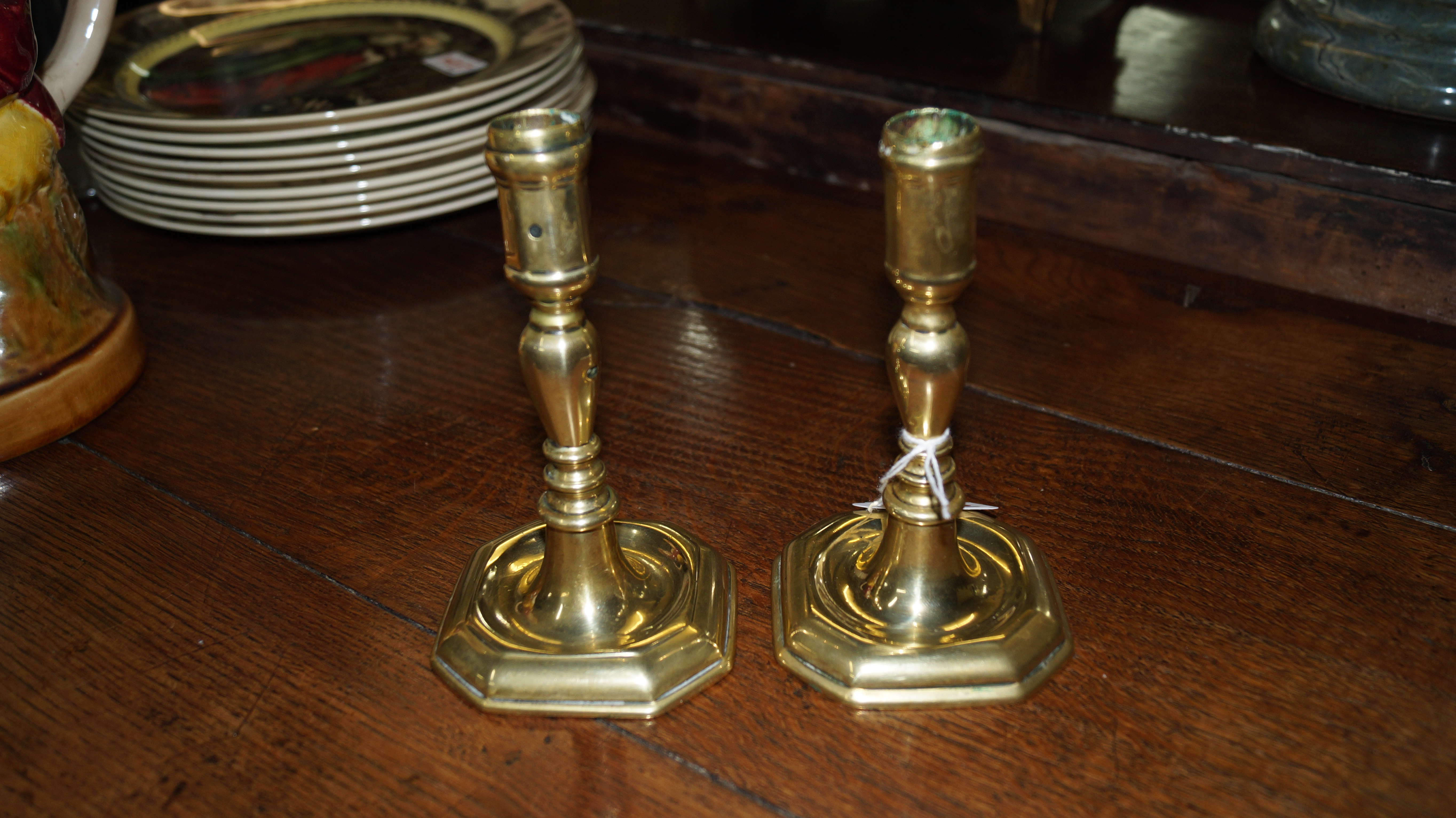 A pair of 18th century cast brass candlesticks, 14cm high.