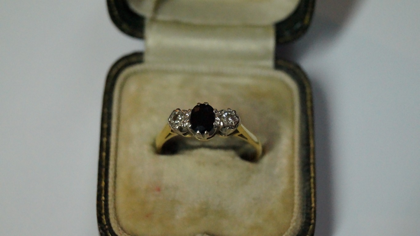 A gold diamond and sapphire three stone ring. - Image 2 of 3