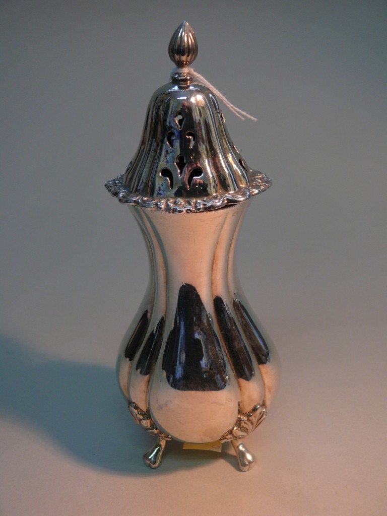 A silver sugar caster, by A.C. & Sons Ltd, London 1975, of bulbous form, on four feet, 6.6oz, 17.