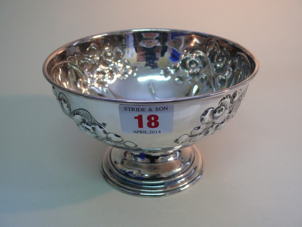 An Edwardian circular silver footed bowl, by J D & S, Sheffield 1905, having embossed floral