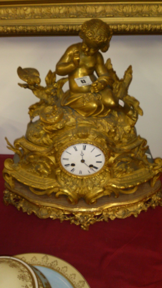 ormolu clock with cherub decoration