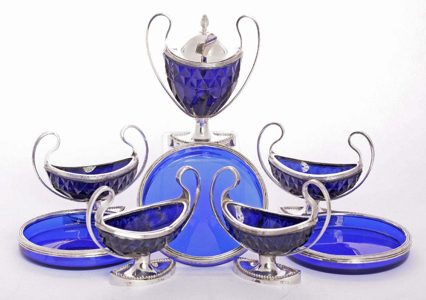 A Dutch five-piece silver-mounted blue glass cruet set,by Jan W Pas, Nijmegen 1795/1811,comprising: