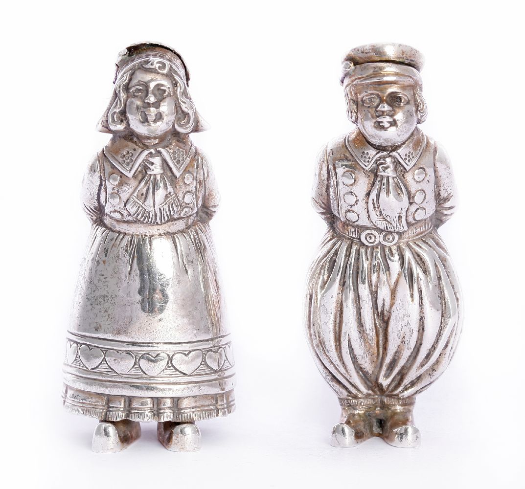 A pair of German novelty silver peppers, by Karl S?hnlein & S?hne, Hanau c.1910,modelled as a boy