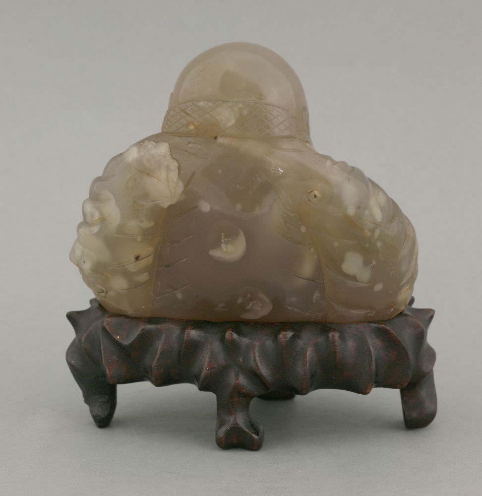 A smoky quartz Budai, 20th century, seated cross-legged holding a rosary, 9.5cm, fitted wood - Image 2 of 2