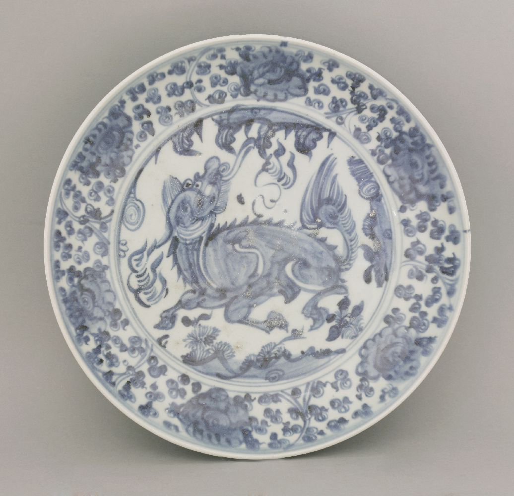 A Zhangzhou blue and white Dish,  AFC early 16th century, vigorously painted with a kylin leaping