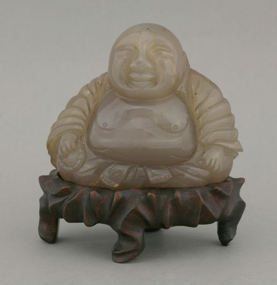 A smoky quartz Budai, 20th century, seated cross-legged holding a rosary, 9.5cm, fitted wood