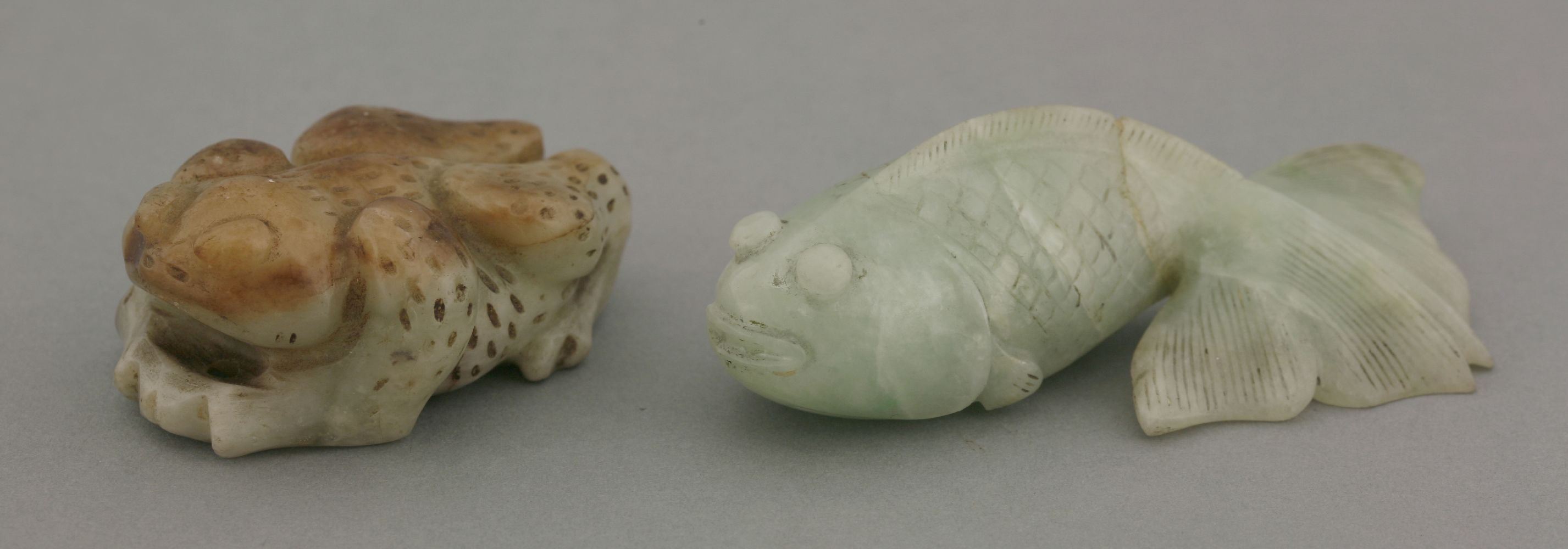A jade toad, 20th century, with brown upper skin, pale green beneath and flecked overall, 5.5cm,