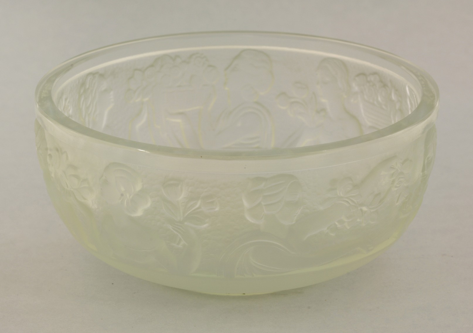 A Sabino opalescent glass bowl,
moulded with a band of ladies admiring flowers in low relief,