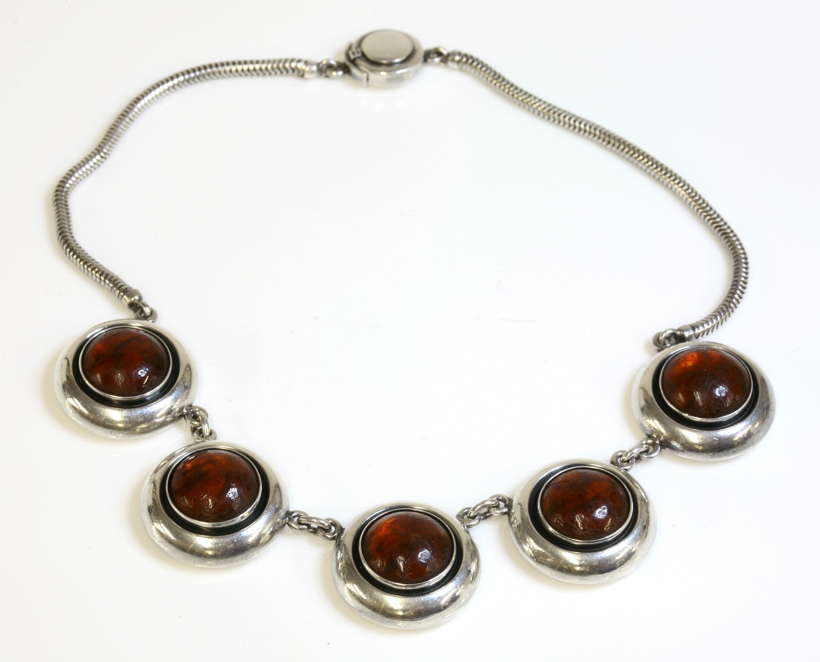 A sterling silver Danish modernist necklace,
by Niels Erik From, with a centrepiece of five circular