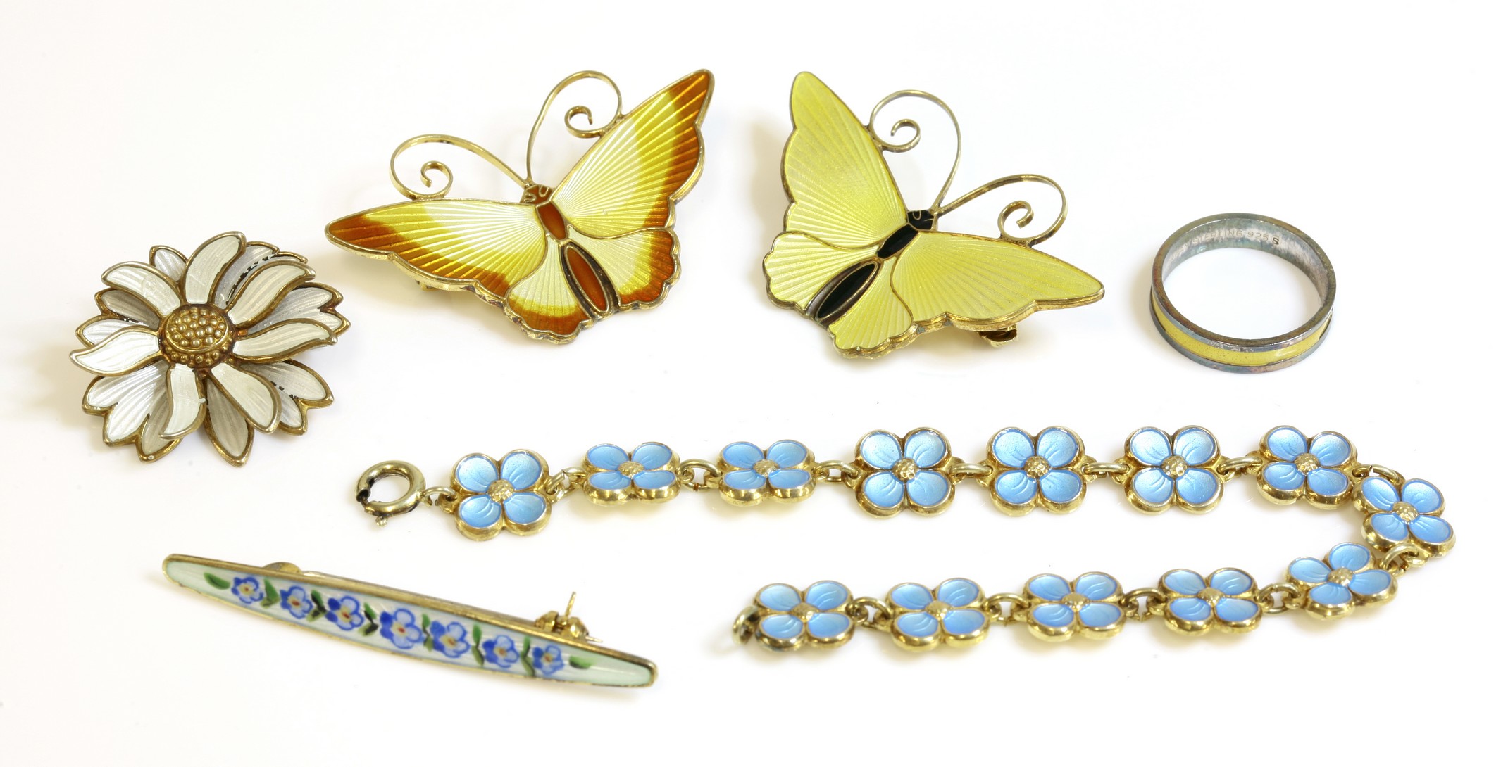 A collection of six Norwegian silver gilt guilloché enamel brooches,
by David Anderson, to include
