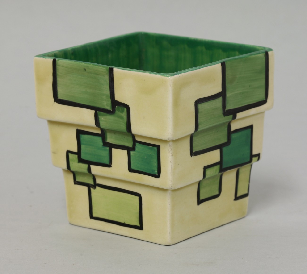 A Clarice Cliff 'Bizarre' stepped vase,
shape no. 368, with green squares,
9cm high CONDITION