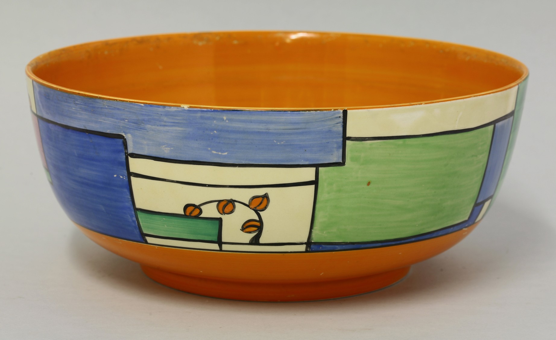 A Clarice Cliff 'Branches and Squares' bowl,
in blue, green and orange, printed marks,
24cm diameter