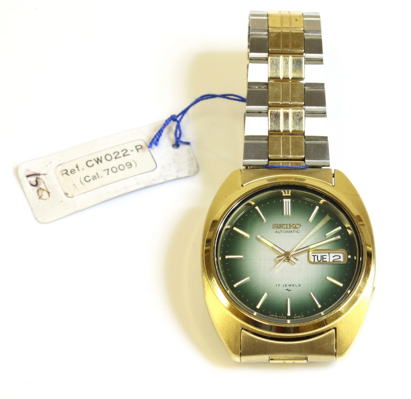 A gentleman's bicolour Seiko automatic bracelet watch, c.1970,
with a shaded green brushed dial with