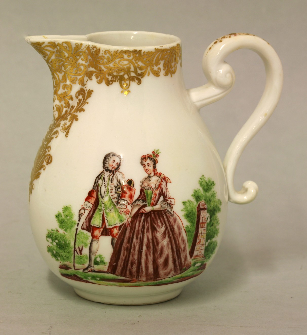 A rare Meissen Hausmalerei Jug,
c.1740, finely enamelled on each side with lovers in a landscape