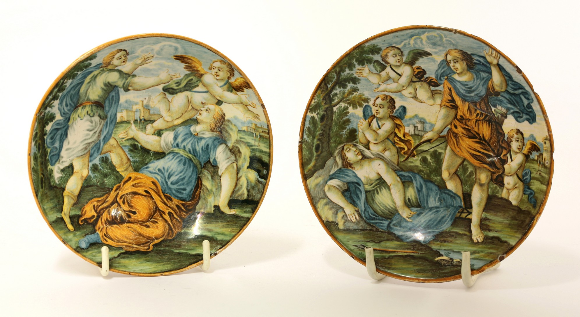 Two Castelli Saucers, 
mid 18th century, each of deep form and painted with mythological subjects,