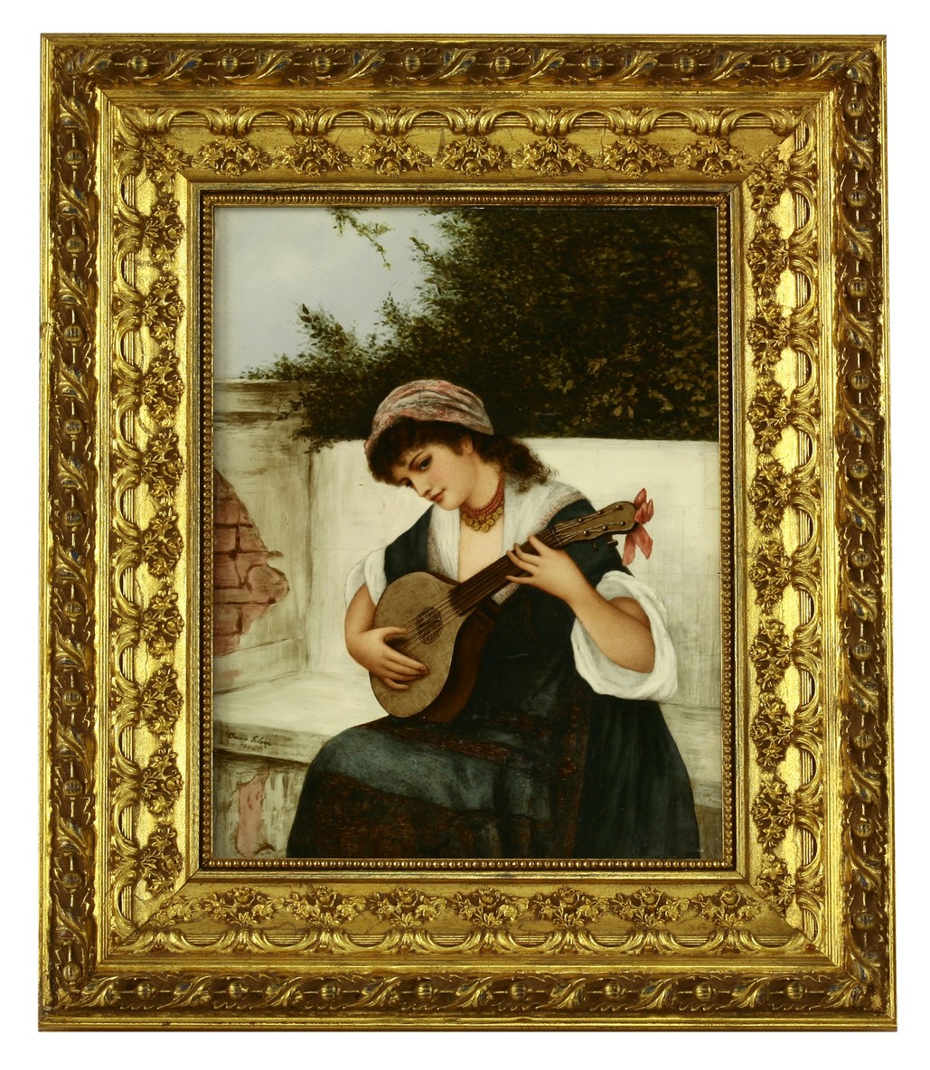 An earthenware Plaque,
1884, by Bessie Gilson, signed, of a gipsy girl playing a lute on a plastered