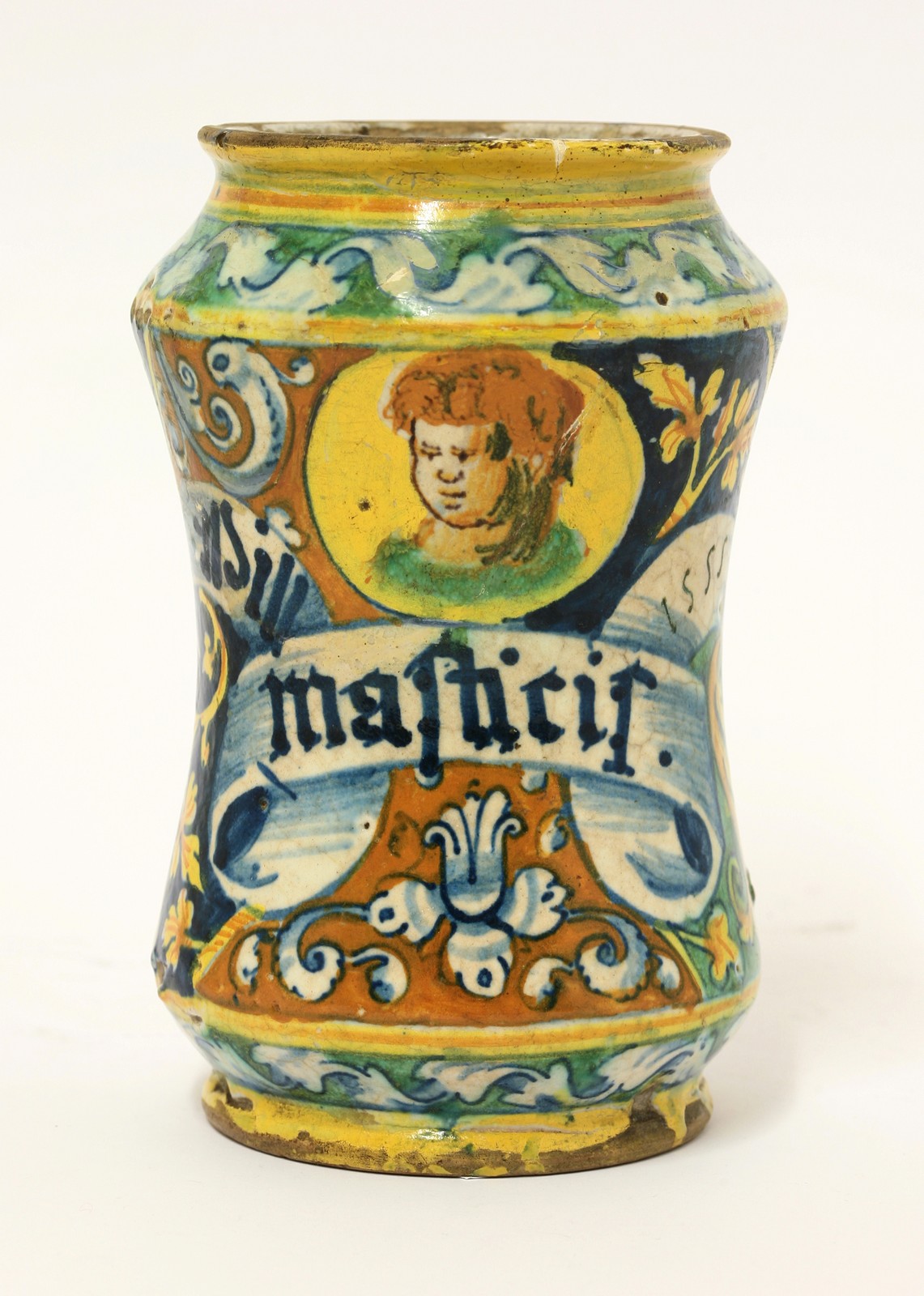 A dated maiolica Albarello,
1555, painted with a portrait of a boy above a label inscribed