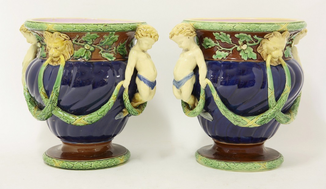 A pair of Minton majolica Cachepots,
date code for 1864, each dark-blue shanked body hung with swags