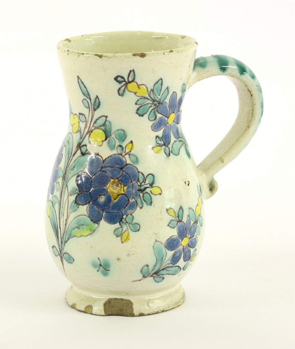 A Continential faience Tankard,  
18th century, of baluster shape,
12cm     EW CONDITION REPORT: